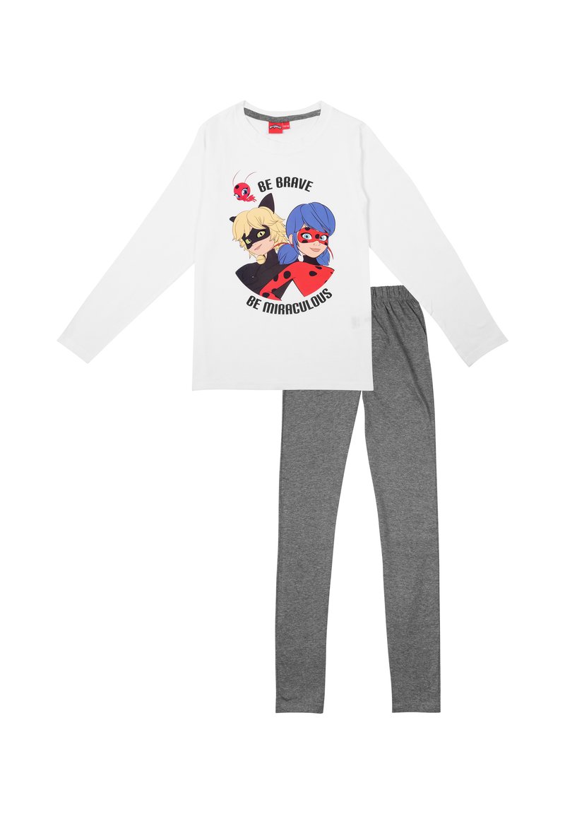 Camicia bianca a maniche lunghe con un design a cartone animato di due personaggi e la scritta "Sii Coraggioso Sii Miracoloso", abbinata a leggings in cotone grigi.