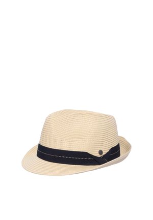 Beige woven fedora hat with a black ribbon band featuring a small round metal emblem on the side.