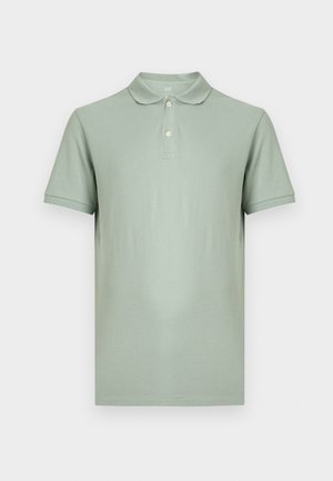 Hästi heleroheline lühikeste varrukatega polo-särk, millel on kaks nuppu ja klassikaline krae, valgel taustal.