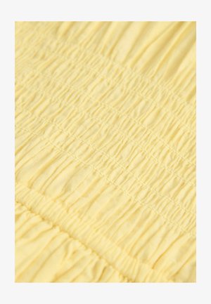 Gelbes Gewebe mit einem strukturierten, gerafften Design, das horizontale Falten aufweist. Weiches, leichtes Material mit gleichmäßig verteilten Nähten.