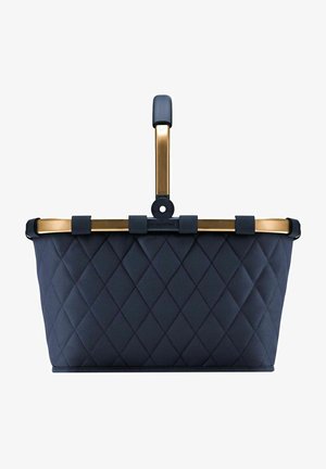 Navy quilted fabric basket with a gold-tone metal handle featuring a textured grip. The design includes a flat base and rounded edges.