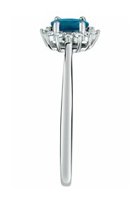 Sterling-Silberring mit einem ovalen Türkisstein, umgeben von kleinen klaren Steinen, mit einem glatten, schlanken Band.