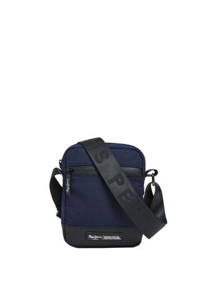 Dark blue crossbody bag made of textured fabric, featuring a front zipper pocket, black accents, and a wide adjustable strap with branding.
