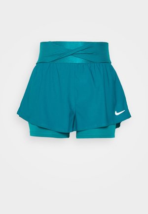 Türkisfarbene Damen-Sportshorts mit hohem, weitem gerafftem Bund und integrierten Kompressionsshorts, mit weißem Nike-Swoosh am Saum.