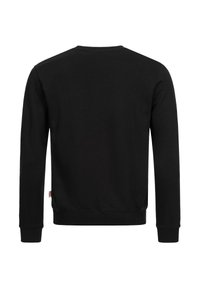 Svart sweatshirt med långa ärmar, rundad halsringning, mjuk textur och ribbade muddarna. Inga synliga logotyper eller mönster på baksidan.