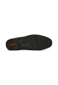 Zwarte rubberen schoenzool met ronde noppen, voorzien van een rode accentstreep en een gestructureerde grip. Gecontourneerde vorm voor comfort en stabiliteit.