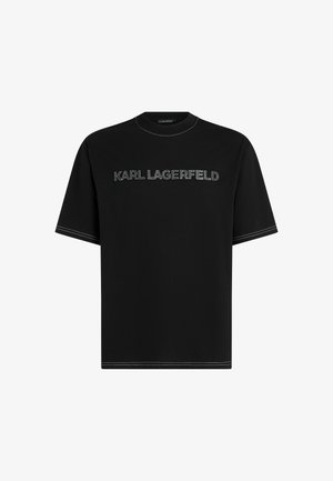 Must, lühikeste varrukatega T-särk, mille rinnal on reljeefne tekst "KARL LAGERFELD" kontrastsetes õmblustes. Ümar kaelus ja sirge lõige.
