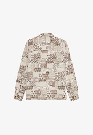 Ilgas rankovėmis marškiniai su siūlių mozaikos dizainu šviesiai rudos ir rudos spalvų atspalviais, puoštas įvairiais geometriniais ir gėlių raštais. Komplektuojami su rankogalių sagomis.