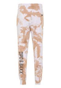Lightweight sweatpants in a tie-dye pattern, featuring white and beige hues, elastic waistband, and side logo detail. Soft fabric texture.