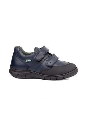 Zapato ortopédico azul marino con puntera negra, dos tiras ajustables de velcro, interior acolchado verde y suela negra texturizada.