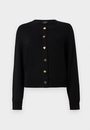 Svart langermet cardigan med gullfargede dekorative knapper som har kløver-, spar-, hjerte-, blomst- og palmetreikoner, ribbestrikkede mansjetter og kant.