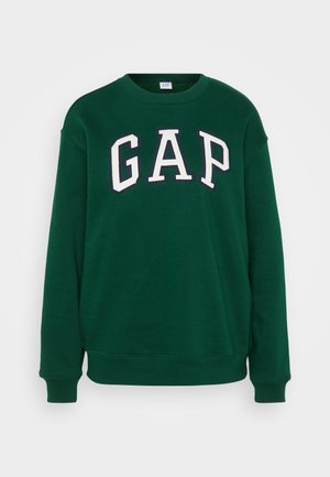Sweatshirt vert arborant le mot "GAP" en lettres blanches et en gras. Fabriqué dans un matériau doux avec des poignets et un ourlet côtelés.