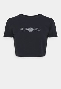 T-shirt noir court en coton, avec des manches courtes, un col rond et des détails en texte blanc avec un graphique de couronne à l'avant.
