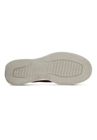 Shoe sole with rubber material, featuring a textured light gray finish. Includes ridged pattern for grip and a logo embossed on the side.