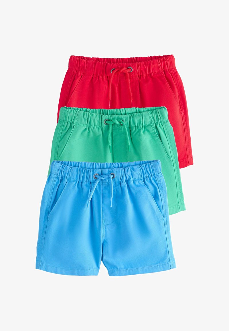 Trzy pary dziecięcych szortów z elastycznym pasem i troczkami w kolorach czerwonym, zielonym i niebieskim, ułożone pionowo na białym tle.