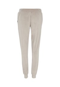 Miękkie beżowe spodnie dresowe wykonane z welurowej tkaniny. Elastyczny pas i ściągacze przy nogawkach. Posiadają boczne kieszenie i gładką, teksturowaną powierzchnię.