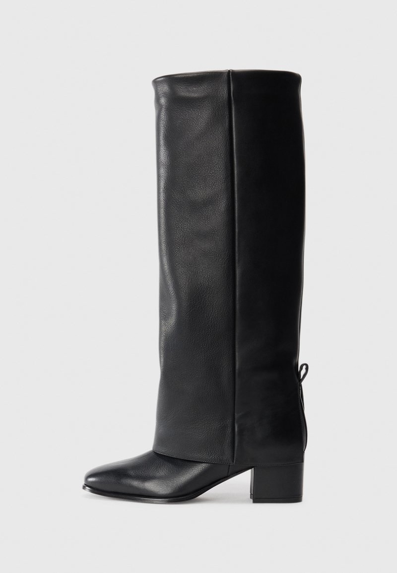 Black leather knee-high boots with a smooth finish, square toe, block heel, and side tie detail for adjustable fit.