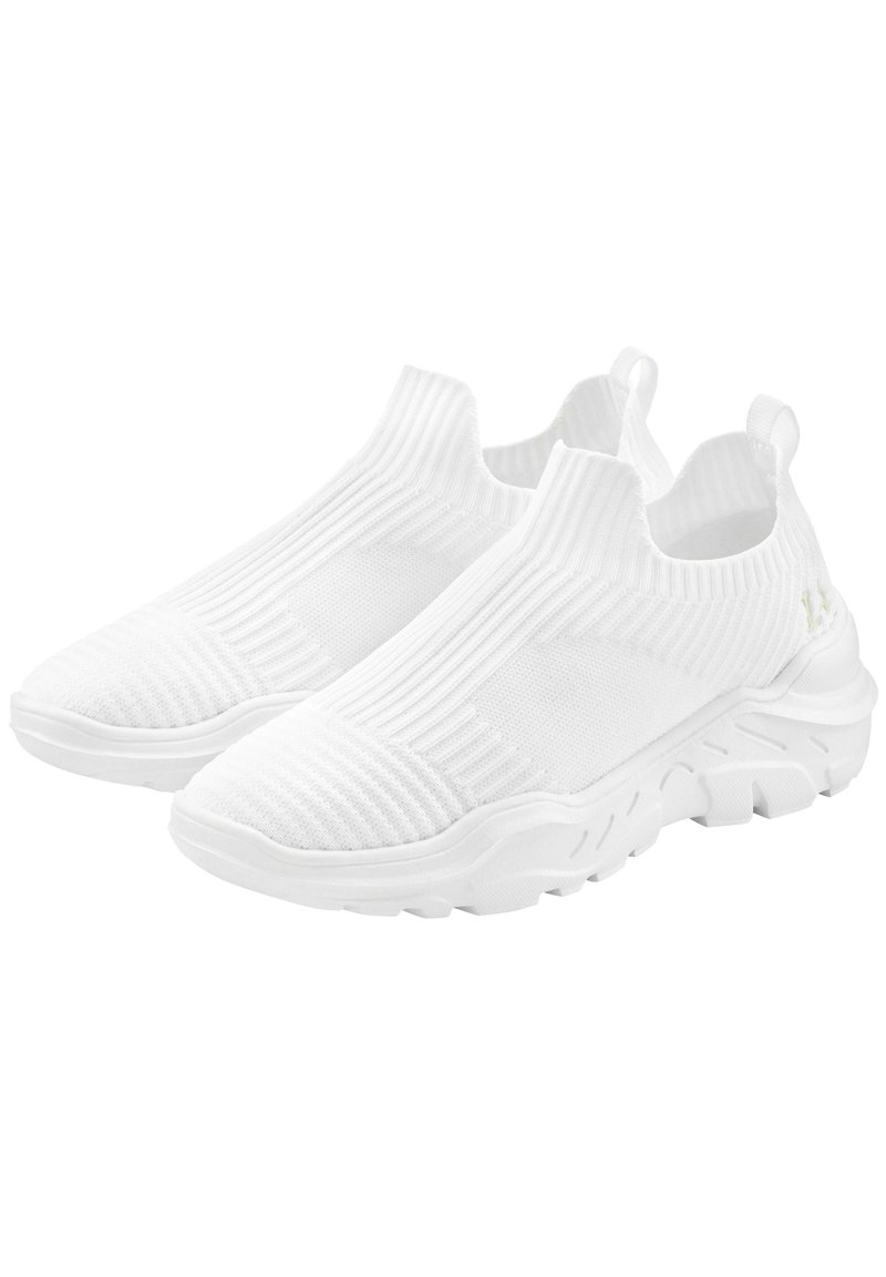 White slip-on sneakers featuring textured knit upper, ribbed collar, and rubber outsole with a curved design and prominent tread pattern.