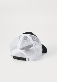 Black cap with a curved visor, featuring a white mesh back and adjustable strap. Textured fabric visible on the visor.