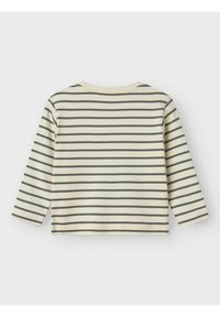 Gestreiftes Langarmshirt in hellem Creme mit dunkelgrauen horizontalen Streifen. Weicher Baumwollstoff; Rundhalsausschnitt und verkürztes Design.