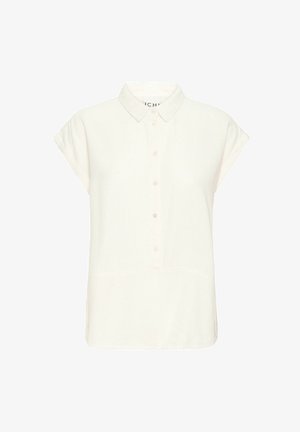 Bijela košulja kratkih rukava s kragnom na dugme, koja ima pet dugmadi sprijeda i blago opušteni kroj. Glatka tekstura.