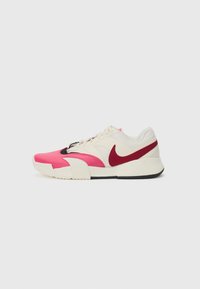 Nike sneaker with a pink and maroon upper, cream accents, textured overlays, and a black sole. Features lacing and a swoosh logo.