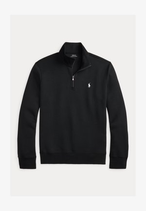 Musta puuvillasekoitteesta valmistettu pusero. Siinä on vetoketjullinen kaulus, resorit hihansuuissa ja helmassa sekä pieni valkoinen logo rinnassa.