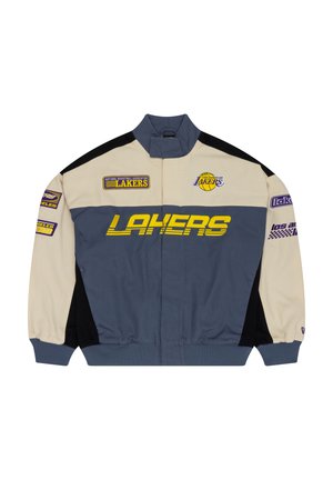 Veste des Lakers en beige, gris et noir. Présente des logos en violet et jaune, un col haut, une fermeture éclair à l'avant et des poignets élastiques.