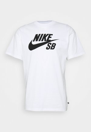Vit bomull t-shirt med korta ärmar, med en stor svart "NIKE SB" logotyp tryckt över bröstet i en djärv, dynamisk stil.