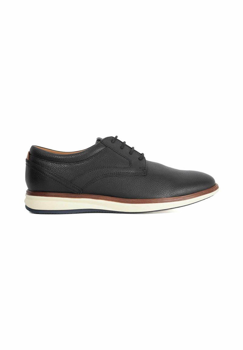 Black leather lace-up dress shoe with textured surface, brown midsole trim, and white and black rubber sole, shown in side profile.