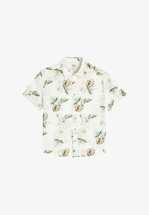 Lyhythihainen nappikauluspaita valkoisesta kankaasta, jossa on vihreitä trooppisia lehtikuvioita ja vaaleanruskeita yksityiskohtia, sekä klassinen kaulustyyli.