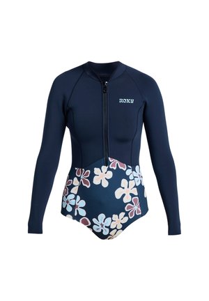 Marineblauw wetsuit met lange mouwen, rits aan de voorkant, bloemenpatroon op de onderste helft, en "ROXY" logo op de borst.