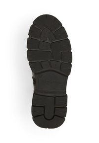 Semelle de chaussure en caoutchouc noir et résistant avec un motif de rainures profondes, marquée "Marc O'Polo", taille 37, indiquée "Fabriqué au Portugal."