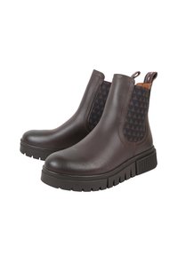 Brązowe skórzane botki do kostki z elastycznymi panelami bocznymi w czarny trójkątny wzór oraz grubą, teksturowaną gumową podeszwą.