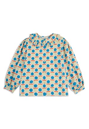 Langarmshirt mit Rüschenausschnitt, das ein blaues und oranges kreisförmiges Muster auf hellgelbem Hintergrund zeigt. Mit Knopfleiste vorne.