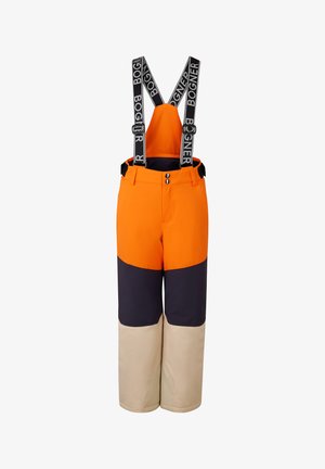 Pantalon de ski orange avec bretelles noires ajustables, en blocs de couleurs marine et beige. Comprend deux poches avant et des fermetures à pression.