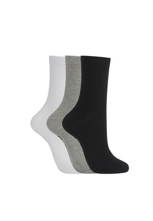Three pairs of plain crew socks in black, gray, and white, arranged side by side on a white background.