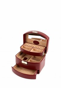 Boîte à bijoux en cuir bordeaux à deux niveaux, avec un miroir, plusieurs compartiments et un design de dessus courbé. Texture lisse et quincaillerie dorée.