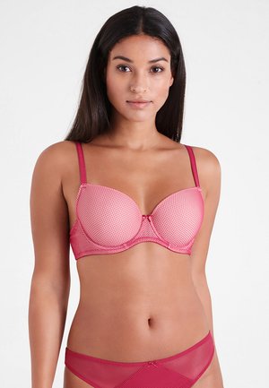 Rosa karierter BH mit gepolsterten Cups, verstellbaren Trägern und kontrastierenden Details. Das Material wirkt glatt mit einem leichten Glanz.
