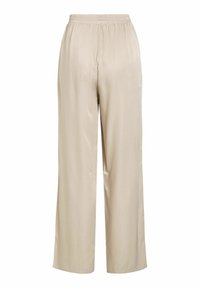 Pantaloni larghi beige realizzati in un tessuto morbido e liscio, con una vita elastica e un fit rilassato che scende morbido lungo le gambe.