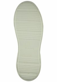 Semelle de chaussure en caoutchouc blanc avec des rainures horizontales, comportant un logo « GANT » en relief et une taille « 42 » sur le bord inférieur.