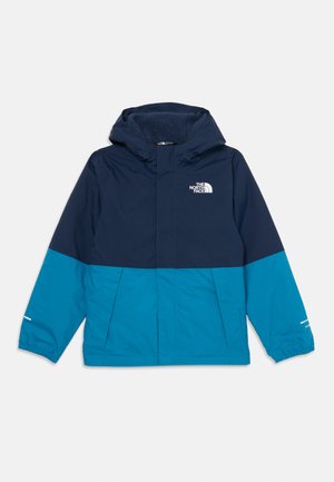 Veste pour homme en bleu marine et teal, dotée d'une capuche, d'une fermeture éclair et du logo The North Face. Fabriquée en tissu doux et texturé avec des poignets élastiques.
