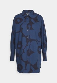 Chemise à manches longues avec boutons en bleu foncé, ornée d'un grand motif floral abstrait. Dotée d'un col classique et d'un ourlet droit. Fabriquée en mélange de coton.