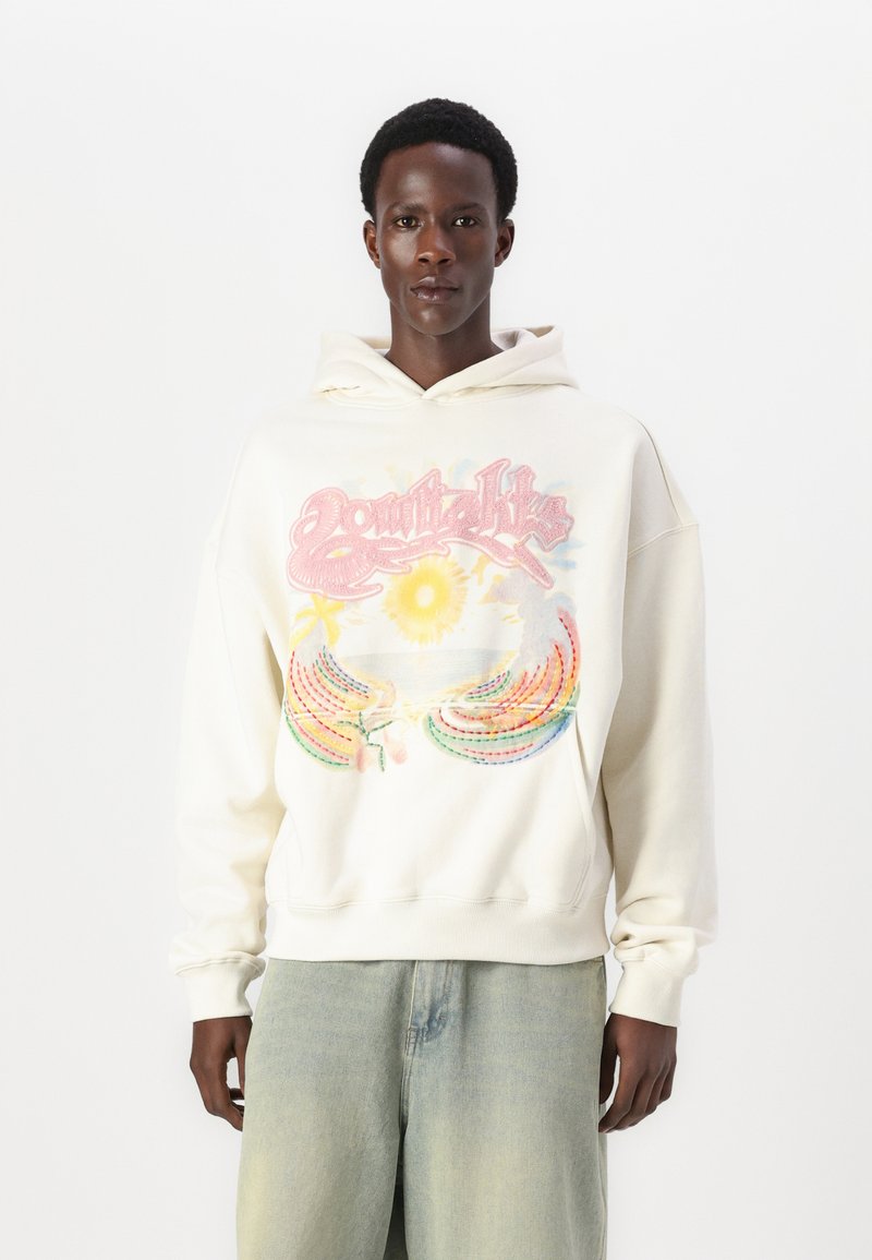 Light cream hoodie with colorful embroidered graphic featuring sun and tropical elements, relaxed fit, and ribbed cuffs and hem.