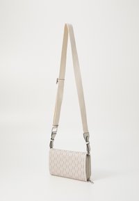 Textured, light beige rectangular bag with a woven pattern, featuring a light strap and metallic hardware details. Zippered closure.