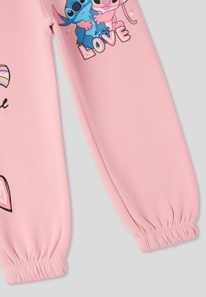 Felpa rosa con maniche lunghe, caratterizzata da una grafica di due personaggi dei cartoni e la parola "AMORE". Tessuto morbido con polsini elastici.
