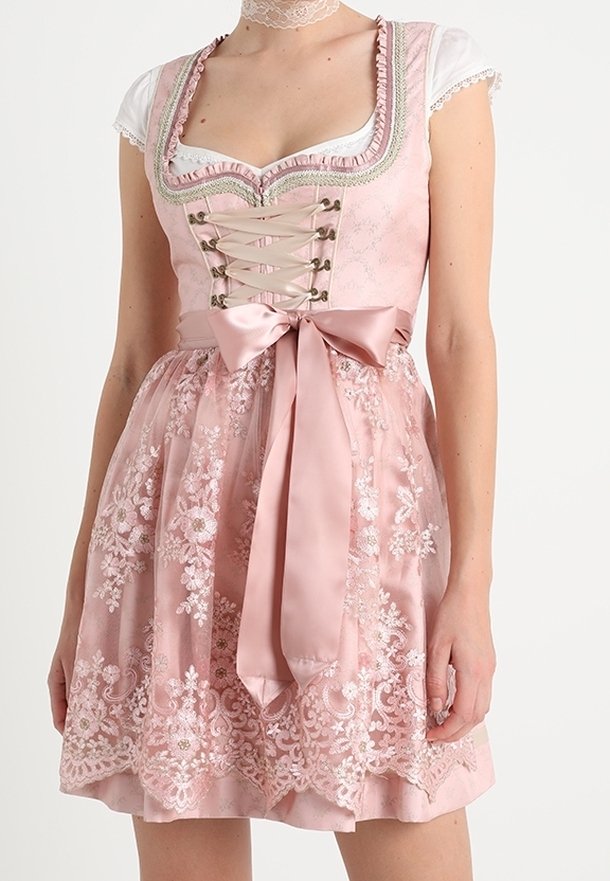 Abito dirndl rosa con scollatura a laccio, ricami floreali, nastro di raso in vita e maniche a palloncino corte. Tessuto morbido e strutturato.