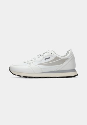 White athletic shoe with a smooth leather upper, gray accents, rounded toe, lace-up closure, and textured rubber sole.