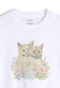 White cotton t-shirt featuring a pastel graphic of two kittens surrounded by flowers. The design incorporates soft colors and delicate details.