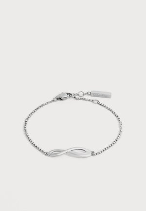 Верижна гривна Calvin Klein в сребрист цвят с централен елемент във формата на символа за безкрайност и закопчалка с логото на марката.
